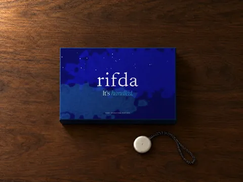 The closed Rifda box, night-sky lid with the rifda wordmark and It’s handled.